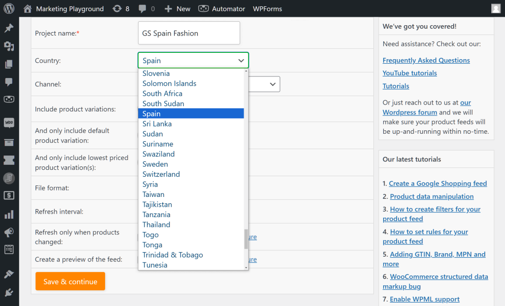 AdTribes' "General feed settings" page, with a focus on the "Country" option, whose dropdown menu shows a list countries, including Spain, which is highlighted