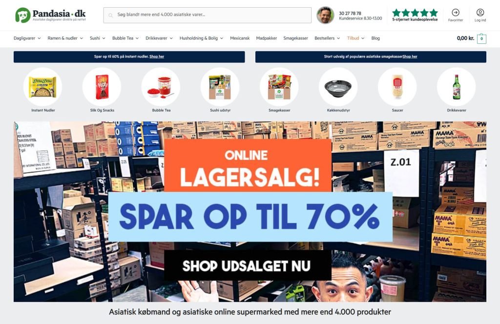 the Pandasia website, showing an image of a warehouse and text describing a sale