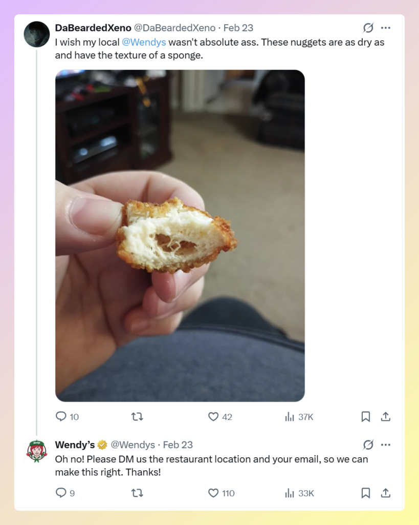 x-reply-example - AdTribes Wendy’s replying to a customer complaint about dry nuggets and asking them to continue the conversation via DM.